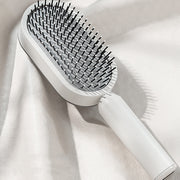 Brosse Auto-Nettoyante Femme Massage Cuir Chevelu & Anti-Statique