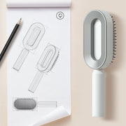 Brosse Auto-Nettoyante Femme Massage Cuir Chevelu & Anti-Statique