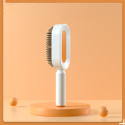 Brosse Auto-Nettoyante Femme Massage Cuir Chevelu & Anti-Statique