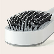 Brosse Auto-Nettoyante Femme Massage Cuir Chevelu & Anti-Statique